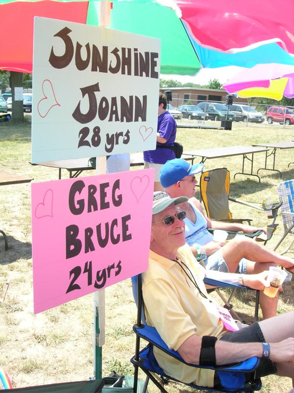 Al and Bob seated in the hot sun at the I/D booth at the picnic